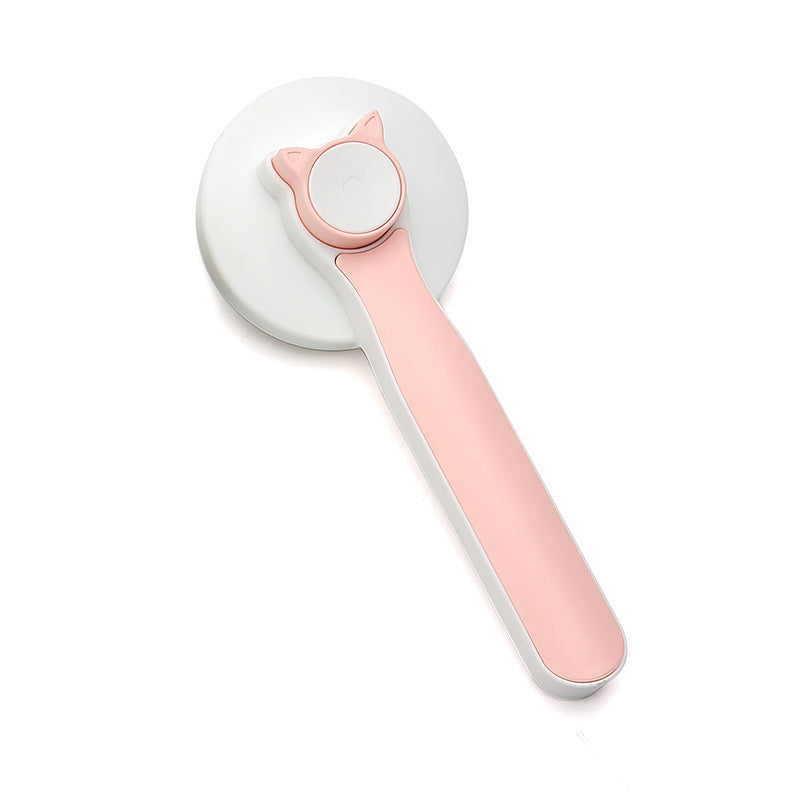 Pink handheld device with a white circular component on a white background