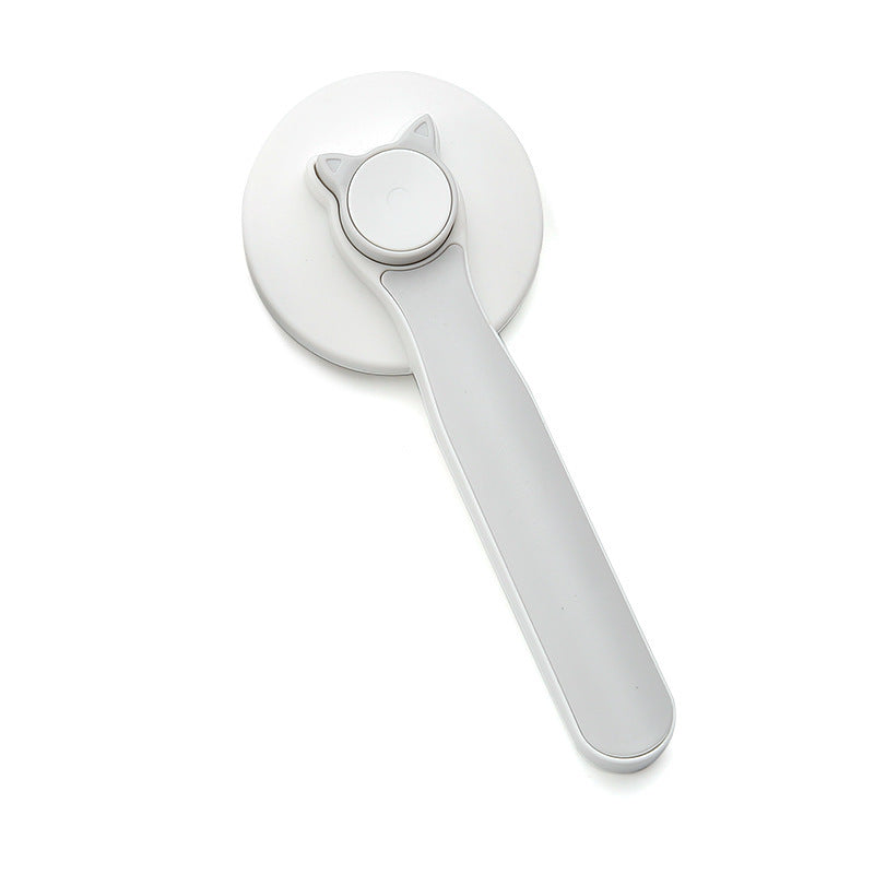 White door handle with a circular design on a white background
